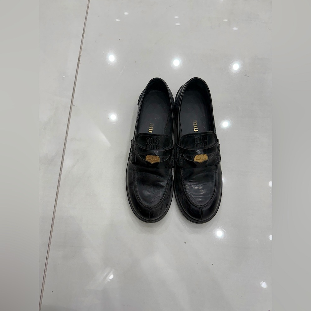 Women’s Miu Miu black leather loafers